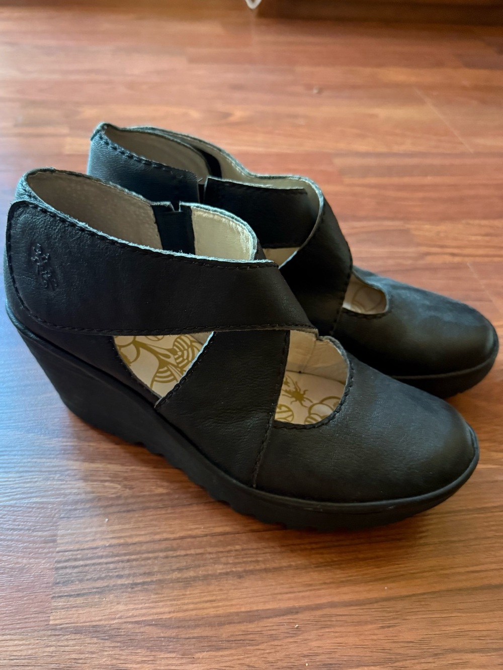Fly London Black Leather Crisscross Wedge Pumps